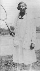 Ora Mae Washington posing with her tennis racket. 